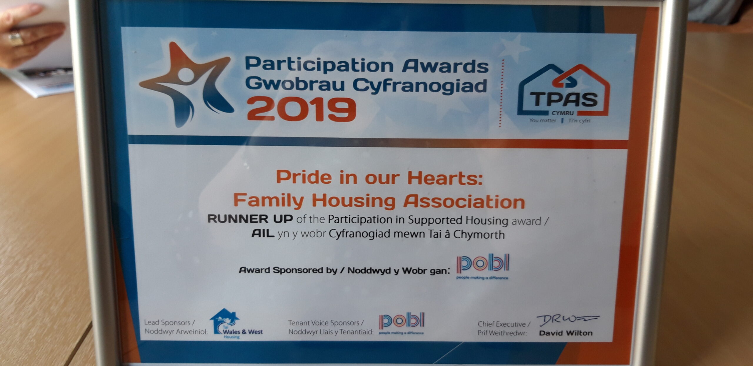 Family Housing Staff and Tenant Duo Win TPAS Award - Caredig